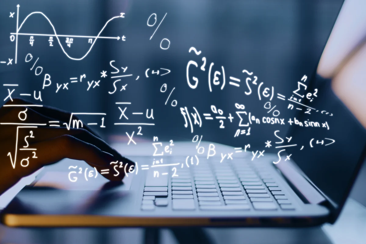 hands-using-laptop-with-mathematical