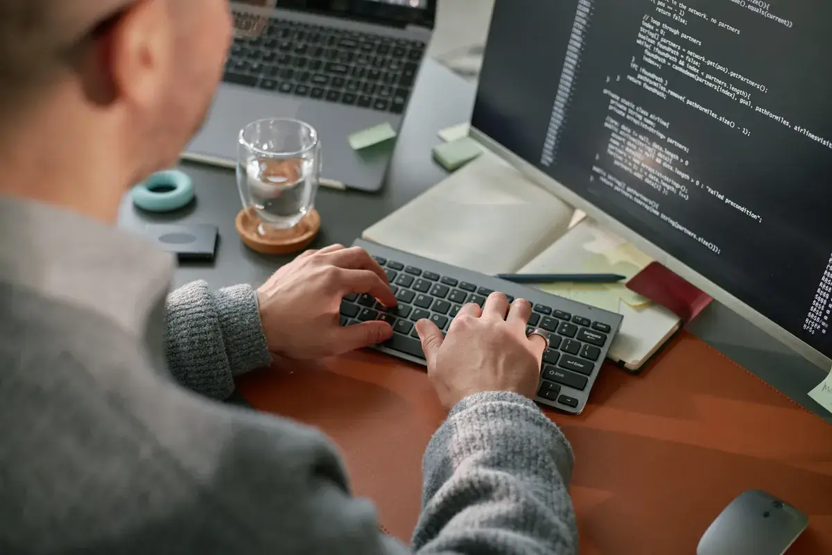 young-adult-caucasian-man-coding-software