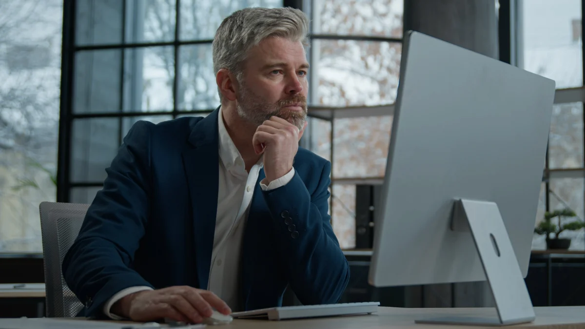 mature-focused-thoughtful-caucasian-businessman